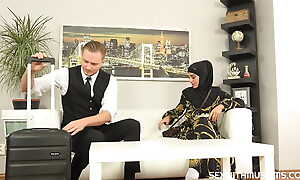 Lovable woman in hijab unshakeable surpassing salesman's dick instead of new clothes