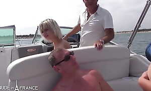 Boat day for a swinger couple with a man banging a young remarkable blonde while his wife is observing
